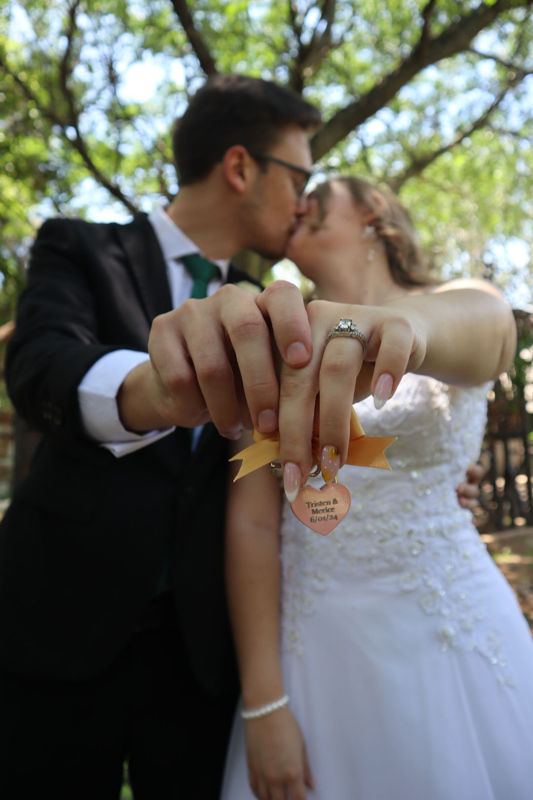 Bride and groom holding a love lock | Forevermore Moments